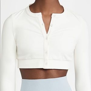 Never worn with tags WEWOREWHAT active wear cropped cardigan top in cream